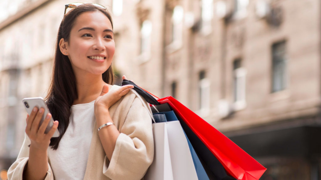 woman holding shopping bags