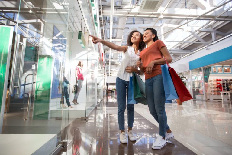 happy women shopping in the mall