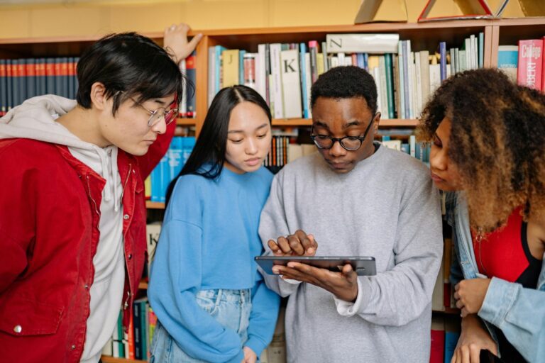 students using tablet in library